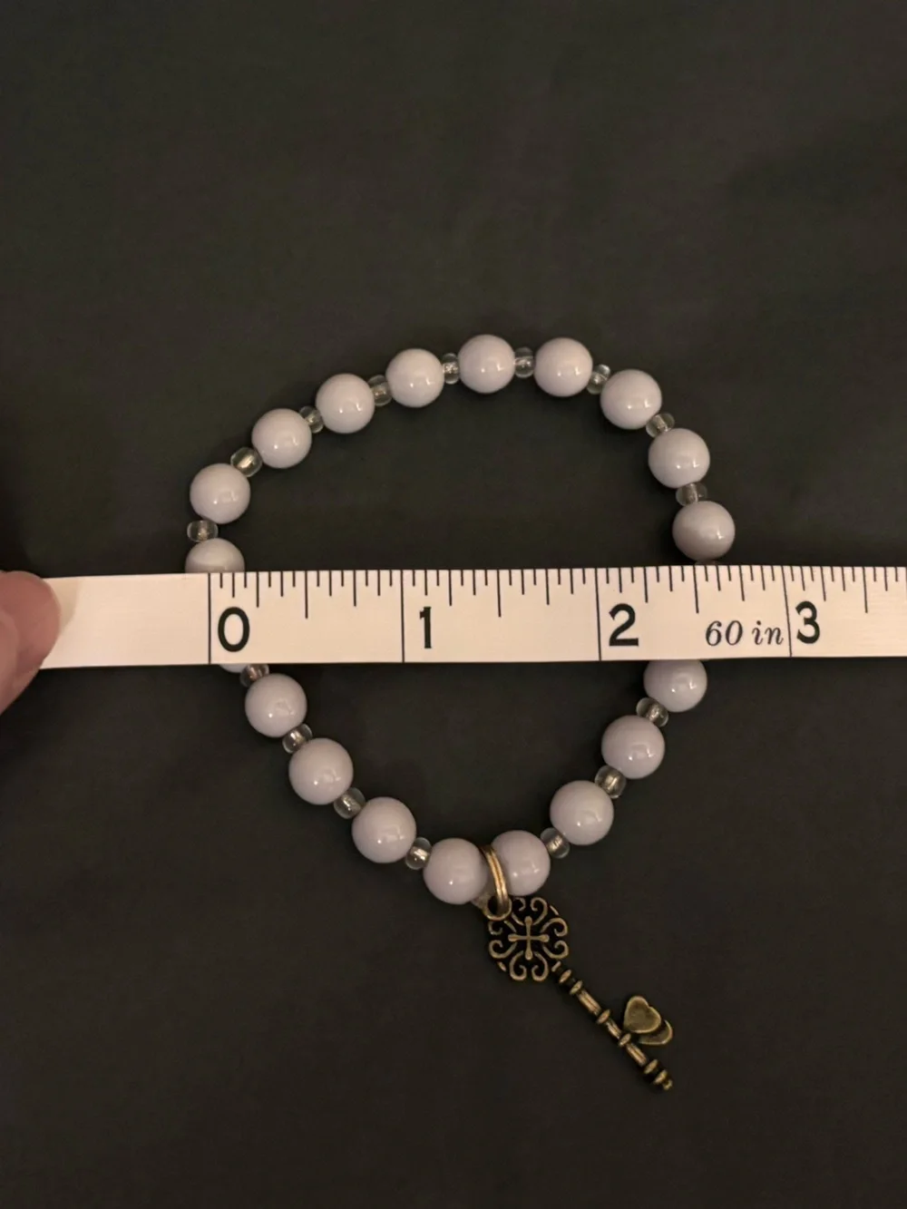 Grey Beaded Stretch Bracelet with Antique Gold Key Charm